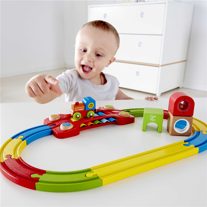 Hape Sensory Railway Circuit | Colorful Wooden Train Set with Accessories, Musical Kids Train Toy with Built-in Xylophone, Rattle And Mirror Block, Multi-Colored